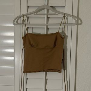 Exulted backless top